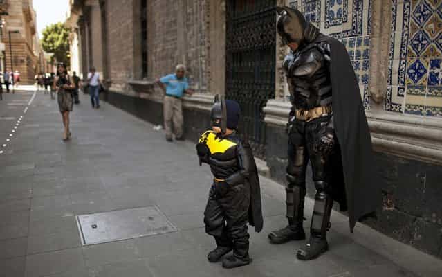 Santiago Gomez, almost 6, received an early birthday gift from his parents – a Batman costume – plus he got to hang out with a Dark Knight street performer in downtown Mexico City, on June 7, 2013. Birthdays don't get much better than that. (Photo by Ivan Pierre Aguirre/Associated Press)