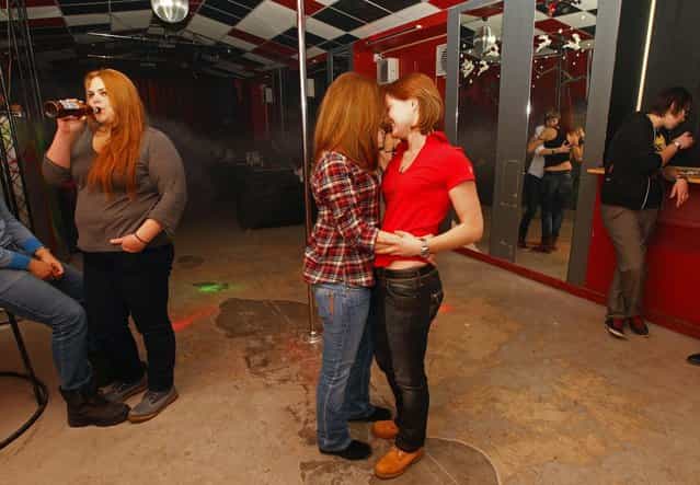 People dance at a private gay club called [Malevich] in St. Petersburg February 2, 2013. (Photo by Alexander Demianchuk/Reuters)