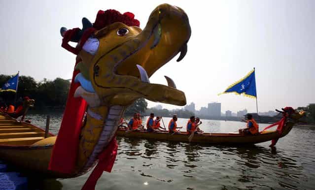 Participants get ready for a dragon boat race as part of celebrations during the Duanwu Festival, also known as the Dragon Boat Festival, in Beijing. (Photo by Ng Han Guan/Associated Press)