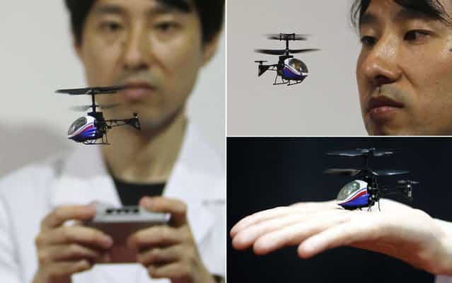 A staff member of the Japanese toy and home appliances maker CCP Co. operates a [Nano-Falcon], the world's smallest infrared remote-controlled helicopter, at the Tokyo Toy Show in Tokyo Thursday, June 13, 2013. The toy helicopter measures 8 centimeter (3.1 inches) in length while weighing 11 grams (0.39 ounces). It's now on sale at 4,704 yen ($50) on the domestic market. (Photos by Koji Sasahara/Yuya Shino/Reuters/AP Photo)