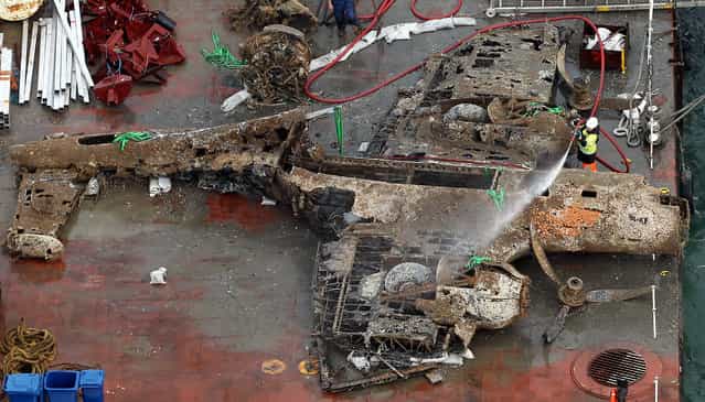The remains of a crashed World War II Dornier bomber, the only surviving German Second World War Dornier Do 17 bomber, lays on a barge near Deal in the English Channel Tuesday June 11, 2013 after being raised from the sea bed Monday evening. (Photo by Gareth Fuller/AP Photo/PA)