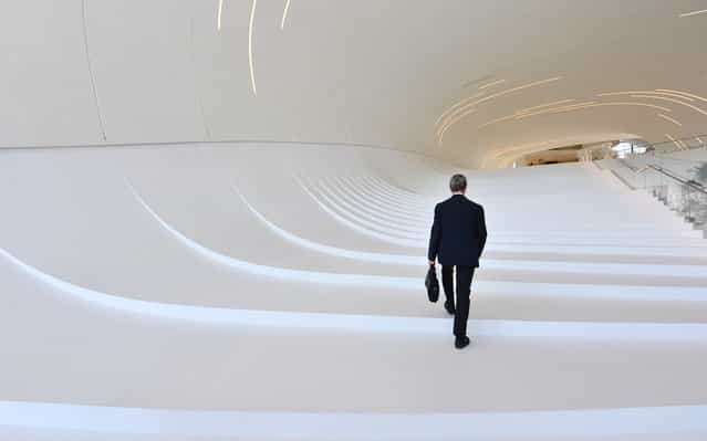 This picture taken on June 7, 2013 shows visitors walking in the Heydar Aliyev Museum in Baku, Azerbaijan. (Photo by Giuseppe Cacace/AFP Photo)