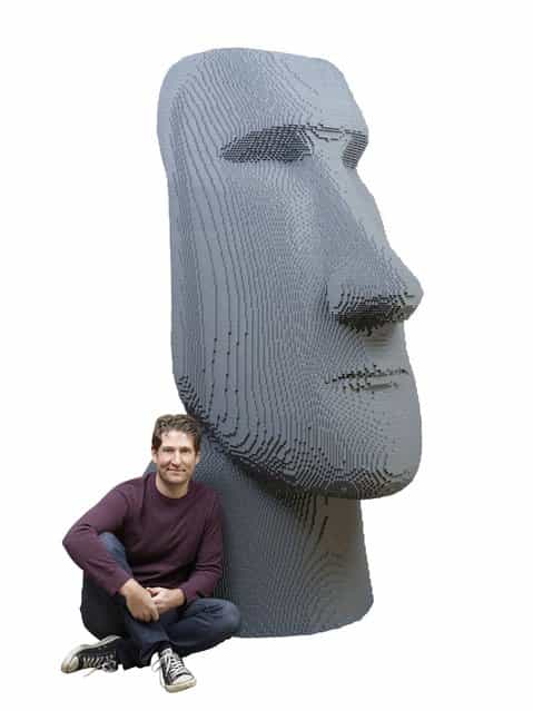Artist Nathan Sawaya poses with some of his latest work. (Photo by Nathan Sawaya/The Art of the Brick)