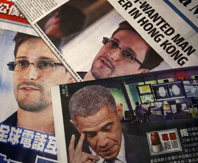 Photos of Edward Snowden, a contractor at the National Security Agency (NSA), and U.S. President Barack Obama are printed on the front pages of local English and Chinese newspapers in Hong Kong in this illustration photo June 11, 2013. Snowden, who leaked details of top-secret U.S. surveillance programs, dropped out of sight in Hong Kong on Monday ahead of a likely push by the U.S. government to have him sent back to the United States to face charges. (Photo by Bobby Yip/Reuters)