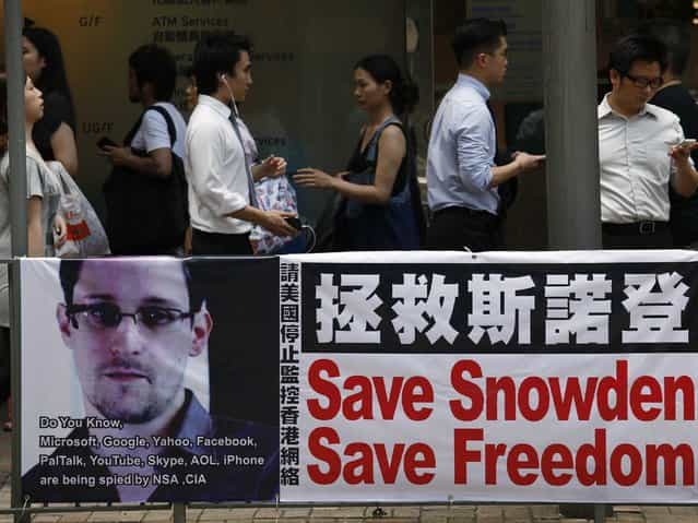 [The state-controlled Chinese media is lauding Edward Snowden’s conduct as the definition of heroism]. (Photo by Bobby Yip/Reuters)