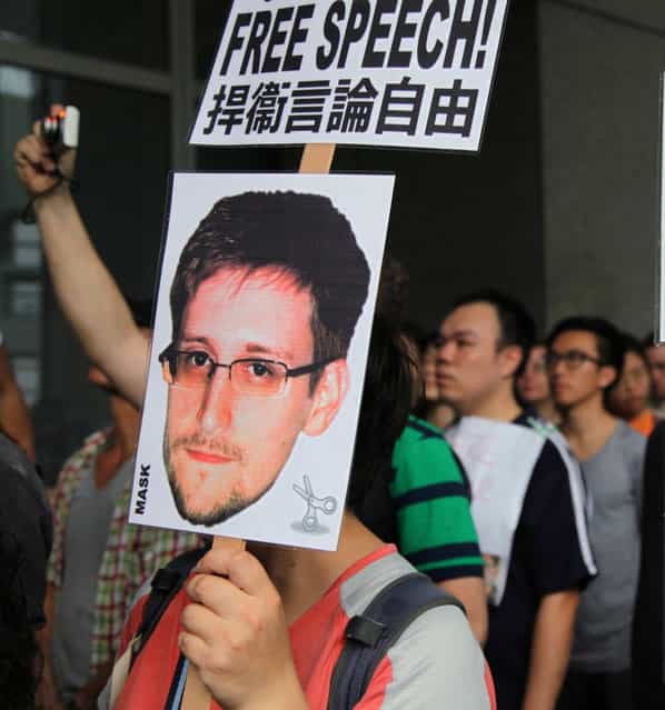 Hong Kong help: Supporters of Edward Snowden gather outside the Hong Kong government building Saturday. (Photo by Bloomberg)