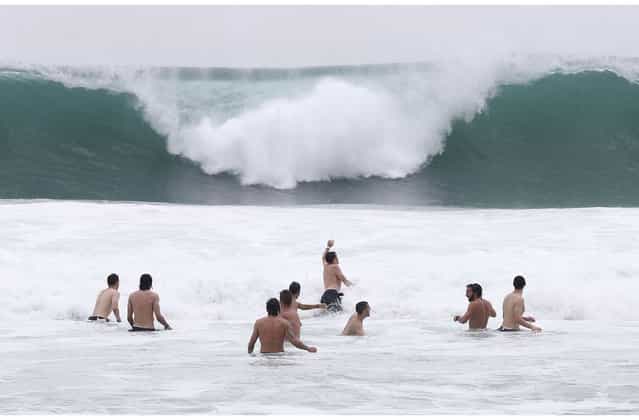 Italy players relax in the breakers of the Atlantic ocean at the soccer Confederations Cup in Rio de Janeiro, Brazil, Monday, June 17, 2013. (Photo by Antonio Calanni/AP Photo)