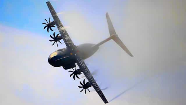An Airbus A400M performs its demonstration flight during the 50th Paris Air Show at Le Bourget airport, north of Paris, Thursday, June 20, 2013. (Photo by Francois Mori/AP Photo)