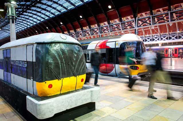 To celebrate the 15th anniversary of Heathrow Express a huge cake shaped train was installed at Paddington station in London, on June 22, 2013. (Photo by REX/SIPA)