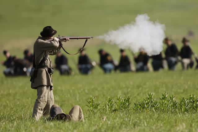 Reenacotrs demonstrate a battle during ongoing activities commemorating the 150th anniversary of the Battle of Gettysburg, Friday, June 28, 2013, at at Bushey Farm in Gettysburg, Pa. Union forces turned away a Confederate advance in the pivotal battle of the Civil War fought July 1-3, 1863, which was also the war s bloodiest conflict with more than 51,000 casualties. (Photo by Matt Rourke/AP Photo)