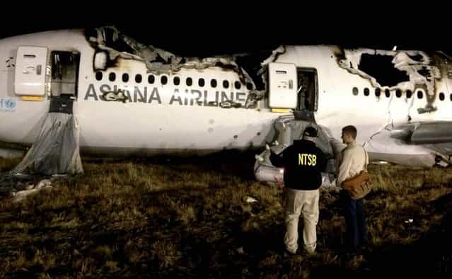 NTSB investigators conduct a first site assessment overnight of Asiana Airlines flight 214 that crashed at the San Francisco International Airport. The Asiana Airlines Boeing 777 crashed while landing after a 10-hour-plus flight from Seoul, South Korea. The flight originated in Shanghai and had stopped in Seoul before the flight to San Francisco. (Photo by NTSB)