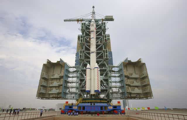 The Shenzhou-7 manned spaceship and the Long-March II-F rocket sit on the launch pad at the Jiuquan Satellite Launch Center,on September 20, 2008. (Photo by Reuters/Stringer via The Atlantic)