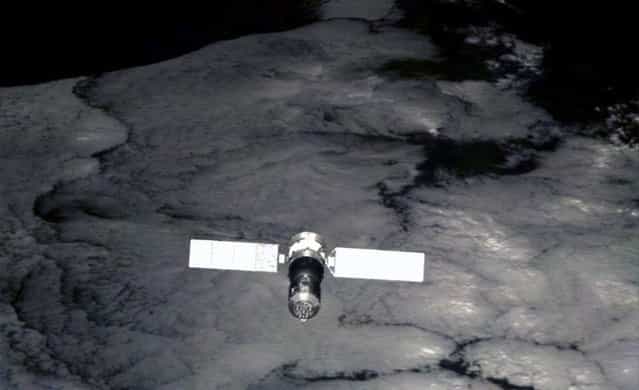 China's Shenzhou-7 spaceship, viewed by a small monitoring satellite six seconds after it was released from the spaceship on Sept. 27, 2008. Launched about two hours after Chinese astronaut Zhai Zhigang finished the country's first spacewalk, the monitoring satellite has sent back over 1,000 pictures of the spaceship, Xinhua said. (Photo by AP Photo/Xinhua via The Atlantic)