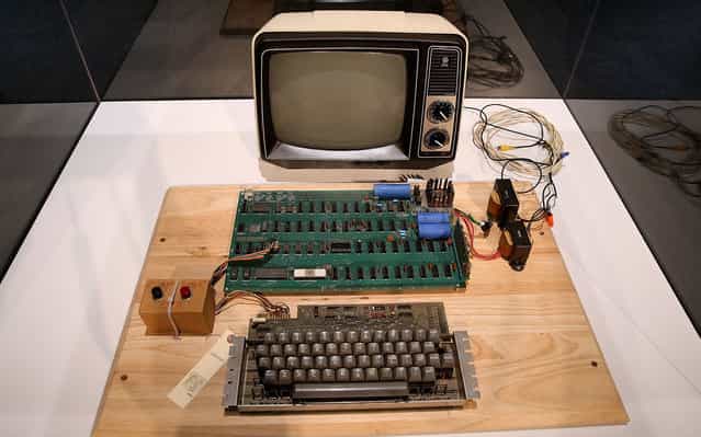 An Apple-1 computer, built in 1976, is displayed during the First Bytes: Iconic Technology From the Twentieth Century, an online auction featuring vintage tech products at the Computer History Museum in Mountain View, California. Christie's is auctioning off an original Apple-1 computer owned by Ted Perry as part of its First Bytes: Iconic Technology from the Twentieth Century, an online auction of vintage tech products. The online auction begins today and runs through July 9. The Apple-1 is expected to fetch between $300,000 and $500,000. (Photo by Justin Sullivan/Getty Images)