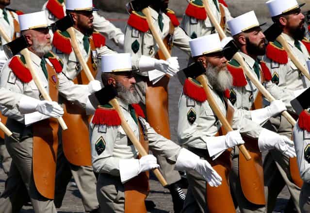 Soldiers from French Foreign Legion take part in the traditional Bastille Day military parade in Paris, July 14, 2013. (Photo by Francois Mori/AP Photo/SIPA)