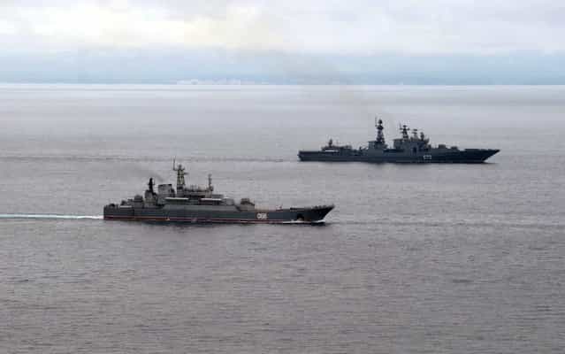Russian Pacific Navy ships sail near the Sakhalin Island during military exercises on Tuesday, July 16, 2013. (Photo by Alexei Nikolsky/AP Photo/RIA Novosti/Presidential Press Service)