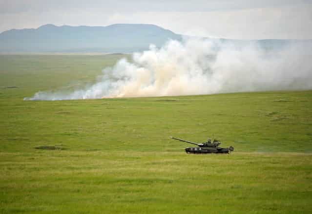 A Russian Army Engenering tank drives near the Baikal Lake in Russia on Wednesday, July 17, 2013. (Photo by Alexei Nikolsky/AP Photo/RIA Novosti/Presidential Press Service)
