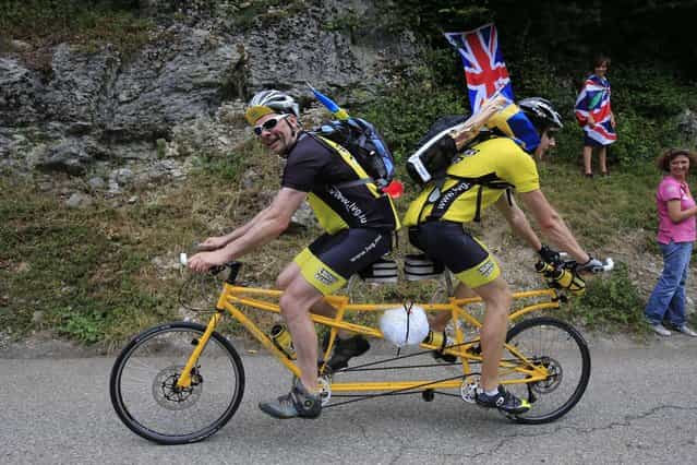 Sweden's Ake Johansson, left, and a friend climb L'Epine pass on a self-made tandem bicycle during the nineteenth stage of the Tour de France cycling race over 204.5 kilometers (127.8 miles) with start in in Bourg-d'Oisans and finish in Le Grand-Bornand, France, Friday July 19 2013. (Photo by Peter Dejong/AP Photo)