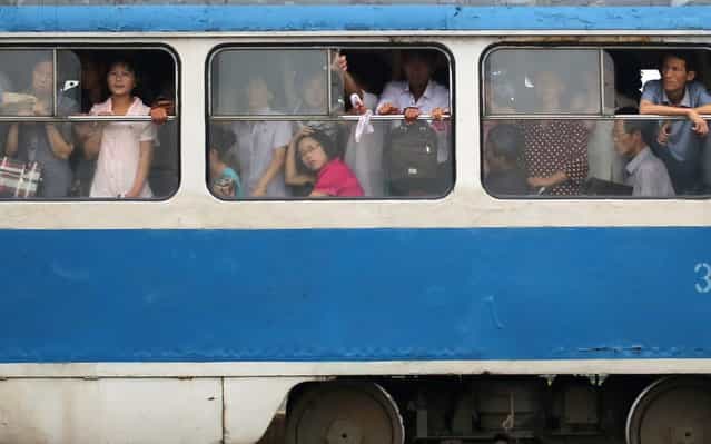 North Korean commuters ride on a tram on Monday, July 22, 2013 in Pyongyang North Korea. (Photo by Wong Maye-E/AP Photo)