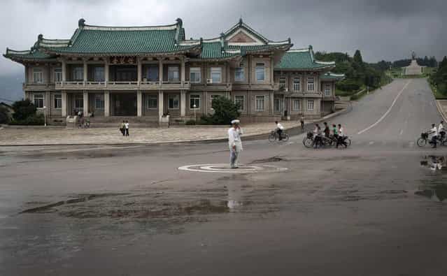A North Korean traffic policeman carries out his duties on Monday, July 22, 2013 in Kaesong, North Korea. (Photo by Wong Maye-E/AP Photo)