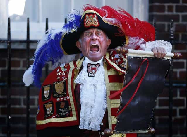 Tony Appleton, a town crier, announces the royal birth outside the Lindo Wing of St Mary's Hospital after Catherine, Duchess of Cambridge gave birth to a baby boy in central London July 22, 2013. Prince William's wife Kate gave birth on Monday to a baby boy, in the Lindo Wing of St Mary's Hospital, who becomes third in line to the British throne, his office said. The royal baby, the couple's first child, was born at 4:24 p.m. (15:24 GMT), weighing 8 lbs and 6 oz. (Photo by Lefteris Pitarakis/Associated Press)
