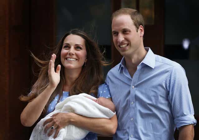 Britain's Prince William and Kate, Duchess of Cambridge hold the Prince of Cambridge as they pose for photographers outside St. Mary's Hospital exclusive Lindo Wing in London where the Duchess gave birth on Monday. (Photo by Lefteris Pitarakis/Associated Press)