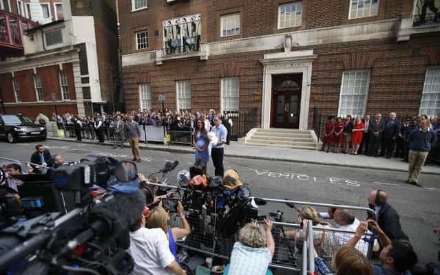 Britain's Prince William and Kate, Duchess of Cambridge hold the Prince of Cambridge, Tuesday July 23, 2013, as they pose for photographers outside St. Mary's Hospital exclusive Lindo Wing in London where the Duchess gave birth on Monday July 22. The Royal couple are expected to head to London's Kensington Palace from the hospital with their newly born son, the third in line to the British throne. (Photo by Lefteris Pitarakis/AP Photo)
