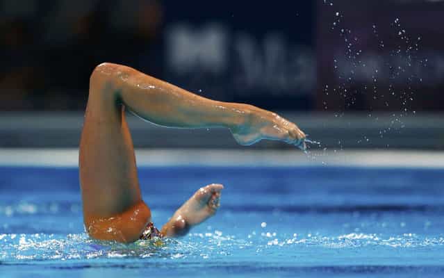Britain's Jenna Randall performs a solo synchronized swimming during the synchronised swimming competition in the FINA World Championships at the Palau Sant Jordi in Barcelona, on July 22, 2013. (Photo by Michael Dalder/Reuters)