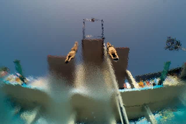 In a picture taken with an underwater camera Mexico's Ivan Garcia and German Sanchez compete in the men's 10-metre synchro platform preliminary diving event in the FINA World Championships at the Piscina Municipal de Montjuic in Barcelona on July 21, 2013. (Photo by Francois Xavier Marit/AFP Photo)