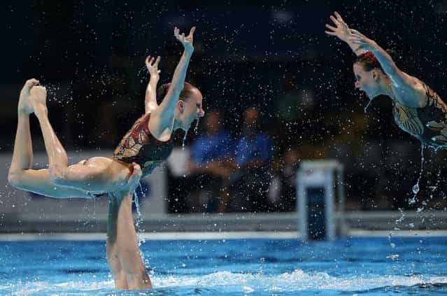 Russia perform their routine in the synchronised swimming team free preliminary event at the FINA Swimming World Championships in Barcelona, Spain, Tuesday, July 23, 2013. (Photo by Emilio Morenatti/AP Photo)