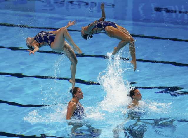 Netherland's team perform in the synchronised swimming team technical final during the World Swimming Championships at the Sant Jordi arena in Barcelona July 22, 2013. (Photo by Michael Dalder/Reuters)