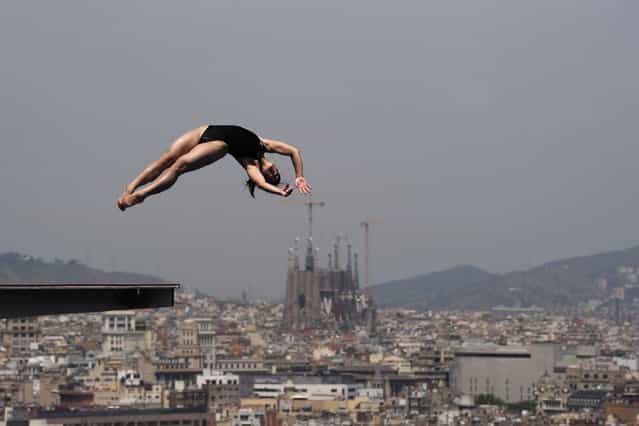 A diver practices at the Piscina Municipal de Montjuic in Barcelona on the eve of the start of the FINA World Championships. (Photo by Josep Lago/AFP Photo)