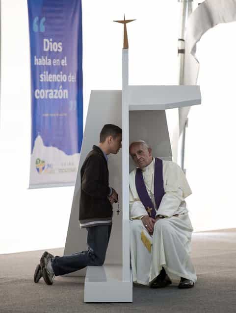 Pope Francis confesses young faithful participating in the XXVIII World Youth Day in Rio de Janeiro on July 26, 2013. (Photo by L'Osservatore Romano)