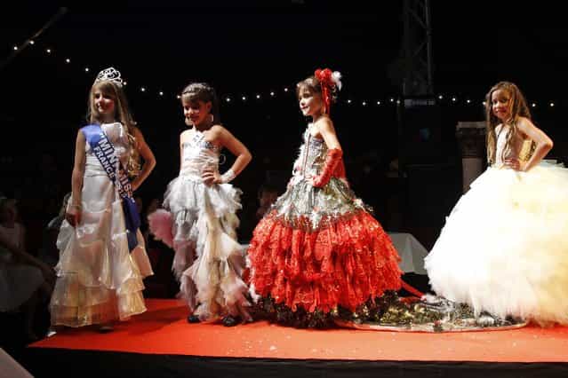 Contestants walk on stage during the [mini-miss] beauty contest in Bobigny, Paris suburb, September 22, 2012. The competition is open for girls aged 7 to 12. (Photo by Benoit Tessier/Reuters)