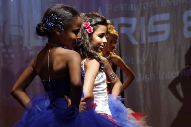 Contestants walk on stage during the [mini-miss] beauty contest in Bobigny, Paris suburb, September 22, 2012. The competition is open for girls aged 7 to 12. (Photo by Benoit Tessier/Reuters)