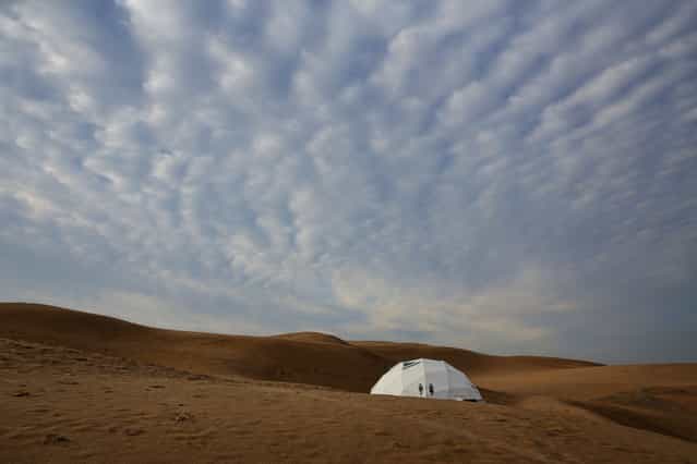 A toilet is seen in Xiangshawan Desert, also called Sounding Sand Desert on July 17, 2013 in Ordos of Inner Mongolia Autonomous Region, China. Xiangshawan is China's famous tourist resort in the desert. It is located along the middle section of Kubuqi Desert on the south tip of Dalate League under Ordos City. Sliding down from the 110-metre-high, 45-degree sand hill, running a course of 200 metres, the sands produce the sound of automobile engines, a natural phenomenon that nobody can explain. (Photo by Feng Li/Getty Images)