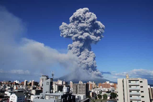 Smoke rises after an eruption of Mount Sakurajima in Kagoshima, Japan, on August 18, 2013. The eruption on Sunday of the 3665 ft. high volcano, one of Japan's most active volcanoes, sent up a 16,404 ft.plume, the highest in recorded history. It is also the volcano's 500th eruption this year, according to media reports citing the local meteorological observatory. (Photo by Kagoshima Local Meteorological Observatory)