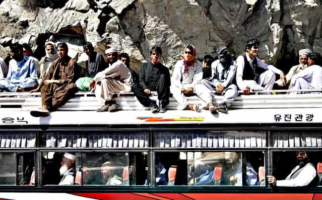 Afghans travel on a bus, on the outskirts of Kabul, Afghanistan, Tuesday, August 27, 2013. (Photo by Ahmad Jamshid/AP Photo)