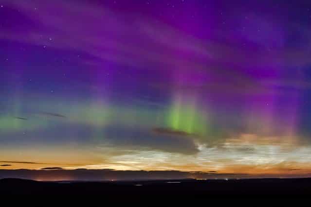 Amazing display of Noctilucent clouds and Northern lights above Caithness, Scotland, on August 20, 2013. (Photo by Guzelian)