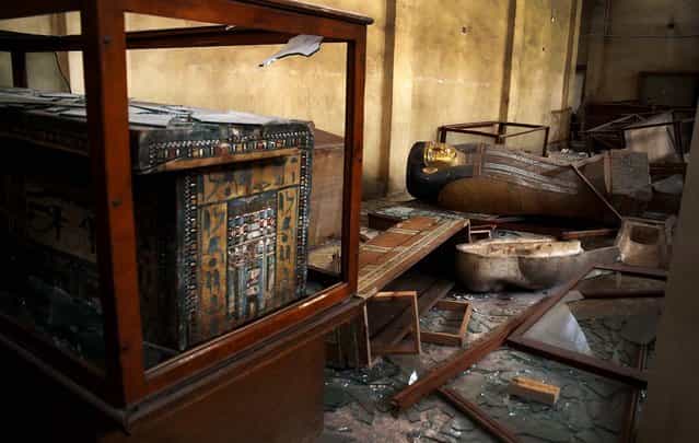 Damaged pharaonic objects lie on the floor and in broken cases in the Malawi Antiquities Museum after it was ransacked and looted in Malawi, south of Minya, Egypt, on August 17, 2013. (Photo by Roger Anis/El Shorouk Newspaper)