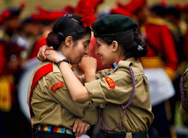 National Cadet Corps members embrace during during a dress rehearsal for India's Independence Day celebrations in Srinagar, on August 13, 2013. (Photo by Danish Ismail/Reuters)