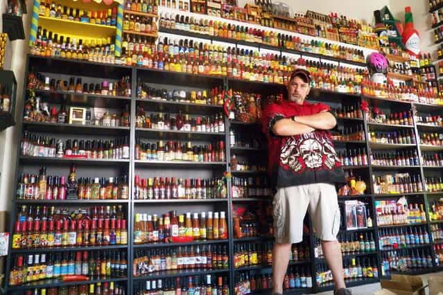 Vic Clinco owns what is thought to be the world's largest hot sauce collection. His amazing 6,000 bottles collection from around the world includes a rare bottle of [Blair's 16 Million Reserve], the hottest sauce on the planet. (Photo by Barcroft Media)