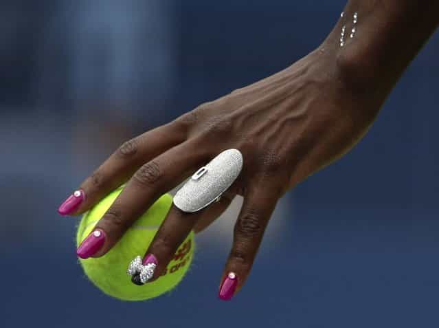 Venus Williams prepares to serve to Belgium's Kirsten Flipkens during the first round of the 2013 U.S. Open tennis tournament Monday, Aug. 26, 2013, in New York. (Photo by David Goldman/AP Photo)
