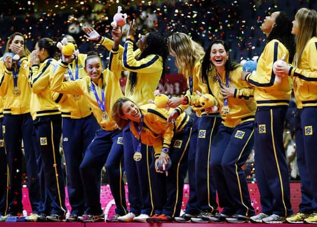 Brazil's players celebrate with the gold medal during the awards ceremony of the World Grand Prix Finals volleyball tournament in Sapporo, Japan, on September 1, 2013. (Photo by Koji Sasahara/Associated Press)