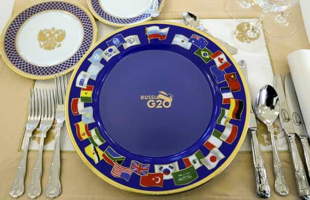 A dinner setting for G-20 leaders is placed on a table prior to a dinner at the Konstantin Palace in St. Petersburg, Russia on Thursday, September 5, 2013. The threat of missiles over the Mediterranean is weighing on world leaders meeting on the shores of the Baltic this week, and eclipsing economic battles that usually dominate when the G-20 world economies meet. (Photo by Sergei Karpukhin/AP Photo)
