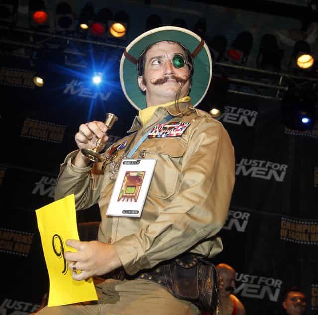Adam Scott strikes a pose as he competes in the Imperial Mustache division during the fourth annual Just For Men National Beard and Moustache Championships Saturday, September 7, 2013 at The House of Blues in New Orleans. More than 150 contestants competed in 18 different categories including Dali, full beard natural and sideburns. (Photo by Susan Poag/AP Photo)