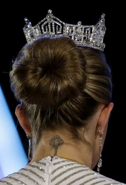 A tattoo is seen on the neck of Miss America 2013 Mallory Hagan during the Miss America 2014 pageant, Sunday, September 15, 2013, in Atlantic City, N.J. (Photo by Julio Cortez/AP Photo)