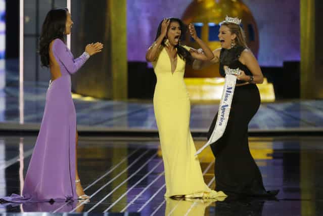 Miss New York Nina Davuluri, center, reacts after being named Miss America 2014 pageant as Miss California Crystal Lee, left, and Miss America 2013 Mallory Hagan celebrate with her, Sunday, September 15, 2013, in Atlantic City, N.J. (Photo by Mel Evans/AP Photo)