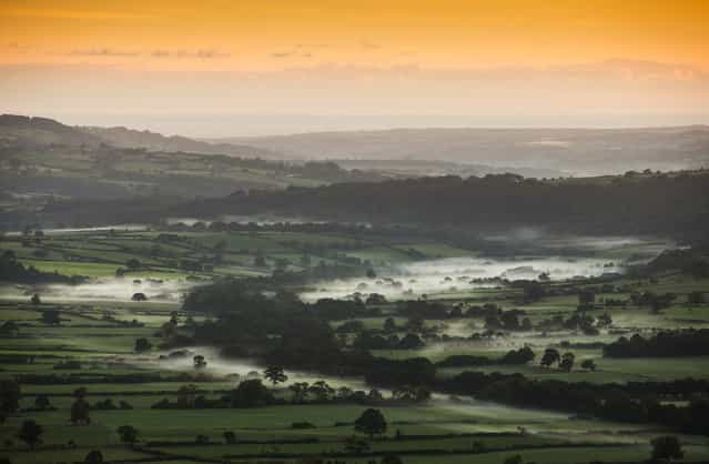 Mist lies in a valley near Goathland in the North Yorkshire Moors at sunrise on September 26, 2013 in Pickering, England. More seasonal Autumnal weather is returning to much of the UK after a late spell of warmer than average temperatures. (Photo by Dan Kitwood/Getty Images)