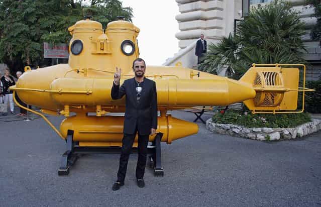British musician and artist Ringo Starr poses near a yellow submarine before receiving the [Insigne de Commandeur de l'ordre des Arts et Lettres] medal during a ceremony as part of the art exhibition [Arternativelight Passion/Ocean] at the Oceanographic Museum in Monaco September 24, 2013. (Photo by Eric Gaillard/Reuters)